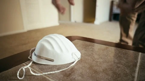 Person picks up protective face mask and keys then leaves home, fixed close up Stock Footage 126568918