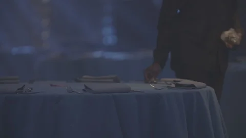 Person place setting table ready for evening banquet dinner Stock Footage 98694442