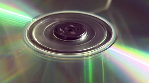 Person places double-sided CD into tray, but it spins briefly and stops due to Video stock 305573832