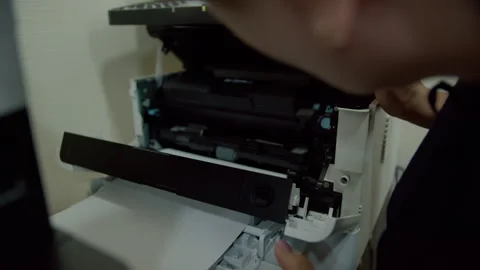 Person placing document into printer scanner tray Stock Footage 311188425