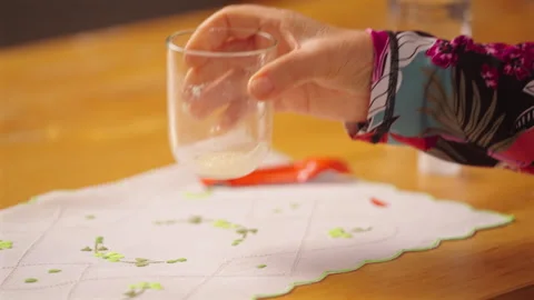 Person Placing Glass On Top Of A Table After Drinking Medicinal Supplements Stock Footage 337042184