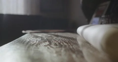 Person Placing Rolled Parchment Sheets on Table for Archive Work or Planning Stock Footage 344348939