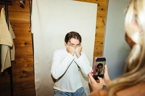 Person playfully posing while being photographed by a friend in a casual se.. Stock Photos
