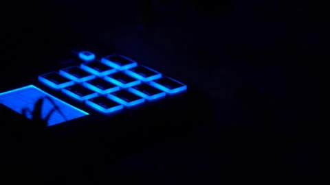 Person playing beat machine in the dark. Stock Footage 240948289