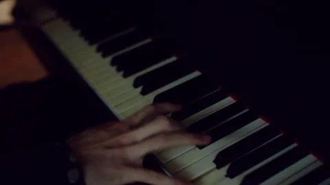 Person playing chords on a piano Stock Footage 279802402