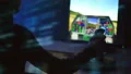 The person playing in computer game with a joystick. evening night time 4k or 4k+ Resolution