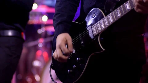 Person Playing Electric Guitar Instrument with Band at Concert Live Performance Stock Footage 127626053