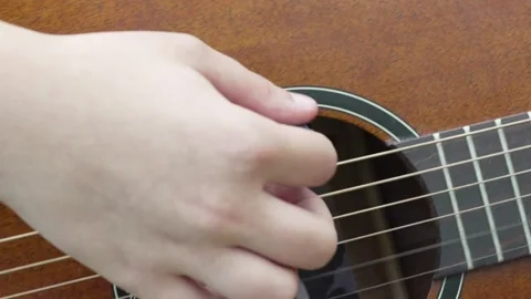 A person playing the guitar Stock Footage 228995433