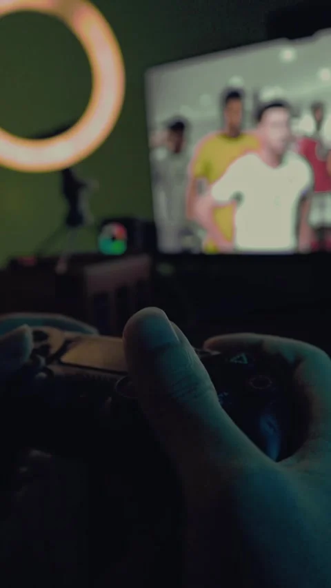 A person playing PlayStation using a controller Video stock 299577826