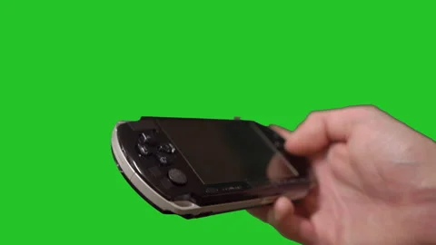 Person playing portable game console. Electronic device for games. Vidéo 170777624