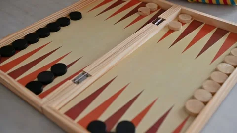 Person playing a strategic backgammon game with dice Video stock 290050138