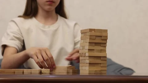A person plays a game of chess while taking notes on a piece of paper Stock Footage 278885713