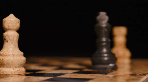 A person plays a move with a white queen, he attacks the black king 스톡 동영상 58428706