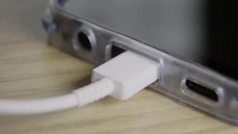 Person plugging usb cable into smartphone Stock Footage 316613267