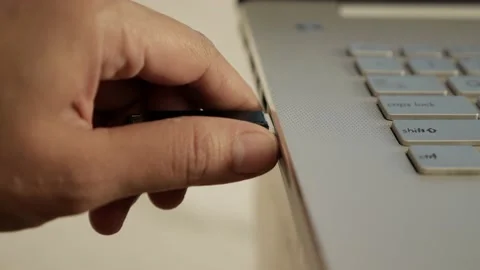 Person pluging out flashdisk from usb port in laptop personal computer, dat.. Stock Footage 231733896