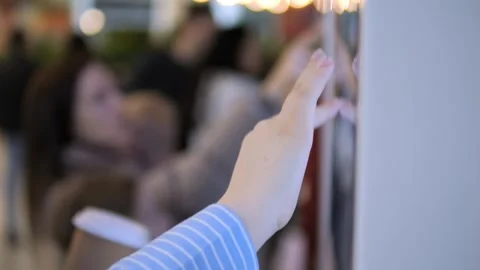 Person is pointing at a wall with a hand Stock Footage 308871783