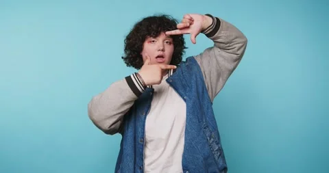 Person points and makes gestures against a blue background in a series of f.. 動画素材 328248722