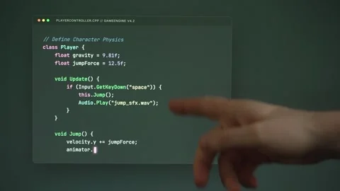 Person points at conceptual game physics code. Stock Footage 334040109