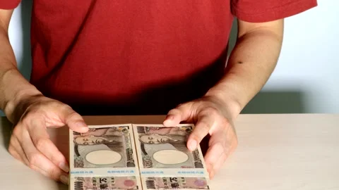 A person posing in front of stacks of cash Stock Footage 334759537