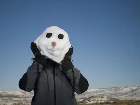 Person posing as snowman Stock Photos