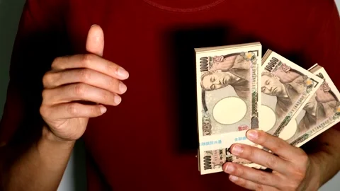 A person posing with a wad of cash. Stock Footage 334686502