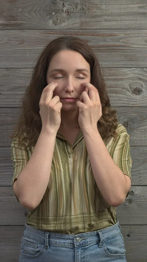 Person practicing EFT, under eye  meridian point.  Vertical video. Stock Footage 279265663