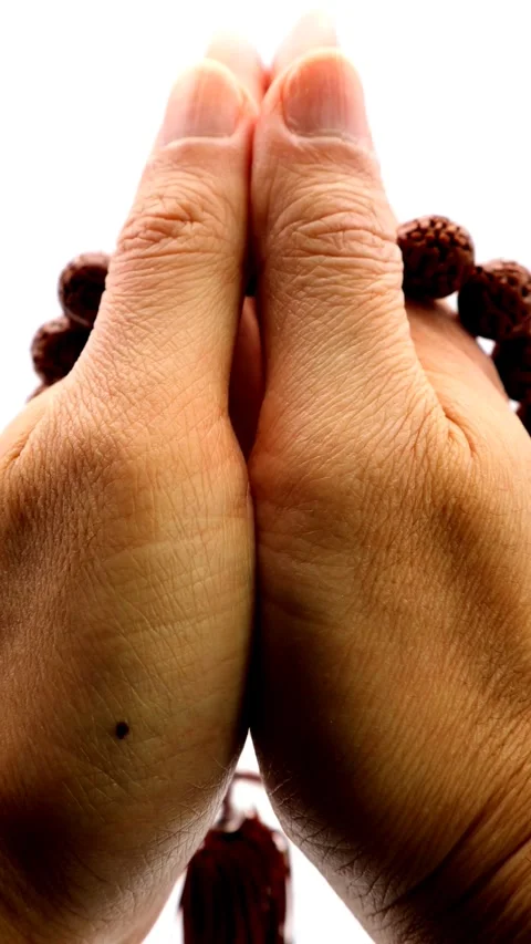 A person praying with prayer beads Video stock 336074610