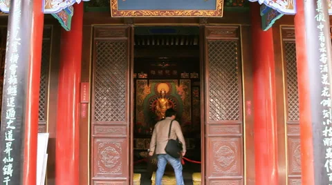 A person prays at a temple  Stock Footage 978452