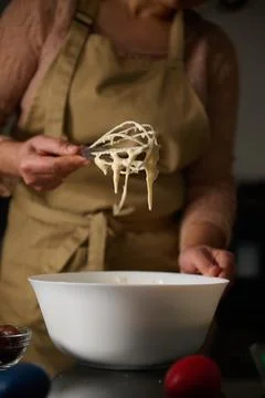 Person Preparing Cake Batter in the Kitchen During Holiday Baking Stock Photos