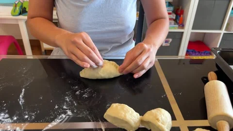 A person is preparing dough on a table with a rolling pin for a recipe Video stock 267689676
