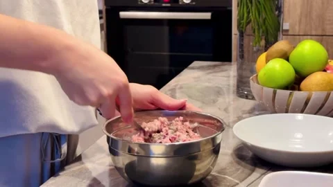 A person is preparing food in a kitchen Stock Footage 282297840