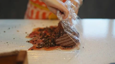 A person is preparing food on a table Video stock 295369998