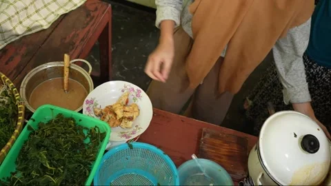 Person preparing gado-gado dish, suitable for cooking Stock Footage 310563524