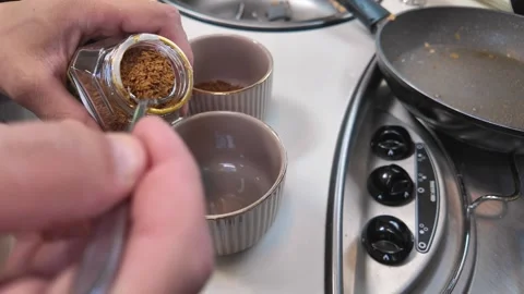 Person preparing instant coffee for breakfast Видео 340629361