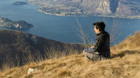 Person is preparing to meditate on the mountain top Stock Footage 59702186