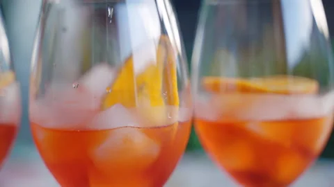 Person preparing summer refreshing aperol spritz cocktail for outdoors party Stock-Footage 252430904