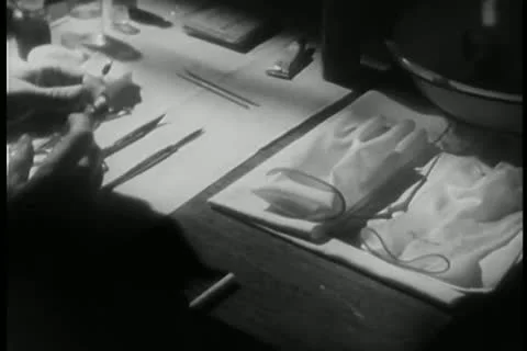 Person preparing for surgery while smoking cigarette Stock Footage 25195447