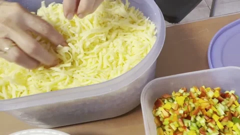 Person preparing vegetables cheese and sauce for homemade pizza Stock Footage 318484122