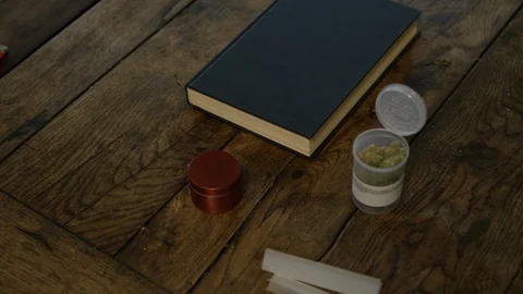 Person preparing weed joint Stock Footage 107690209