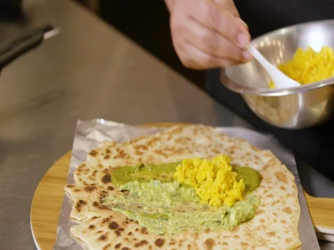 Person preparing a wrap Stock Footage 83185927