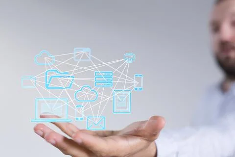 A person presenting a 3D render of cloud-connected to many objects on a virtu 写真素材