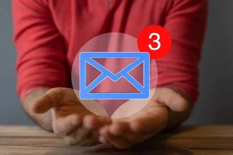 Person presenting a 3D render of email icons in work space 写真素材