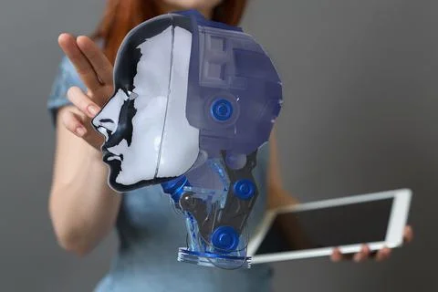 Person presenting a 3D render of a human head Stock Photos