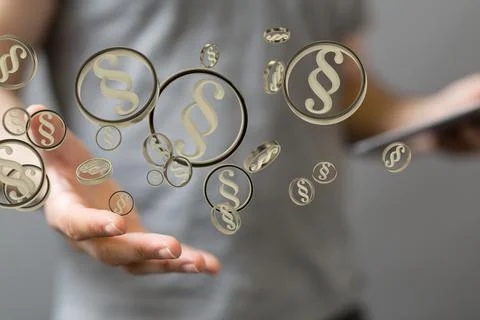 A person presenting the 3D render of paragraph section signs - law and justic Stock Photos