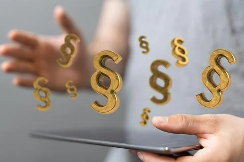 A person presenting the 3D render of paragraph section signs - law and justic Stock Photos