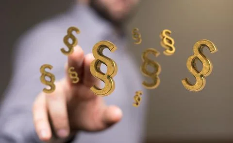 A person presenting the 3D render of paragraph section signs - law and justic Stock Photos