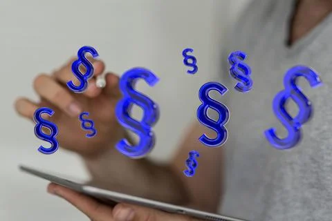 A person presenting the 3D render of paragraph section signs - law and justic Stock Photos