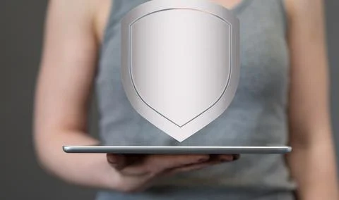 Person presenting a 3D render of shield protection concept Stock Photos