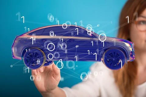 A person presenting the virtual projection of autonomous online car icon with 写真素材