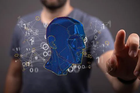 Person presenting the virtual projection of the polygonal human face Stock Photos